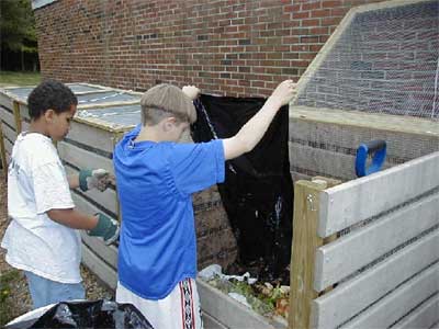 students adding to the bin